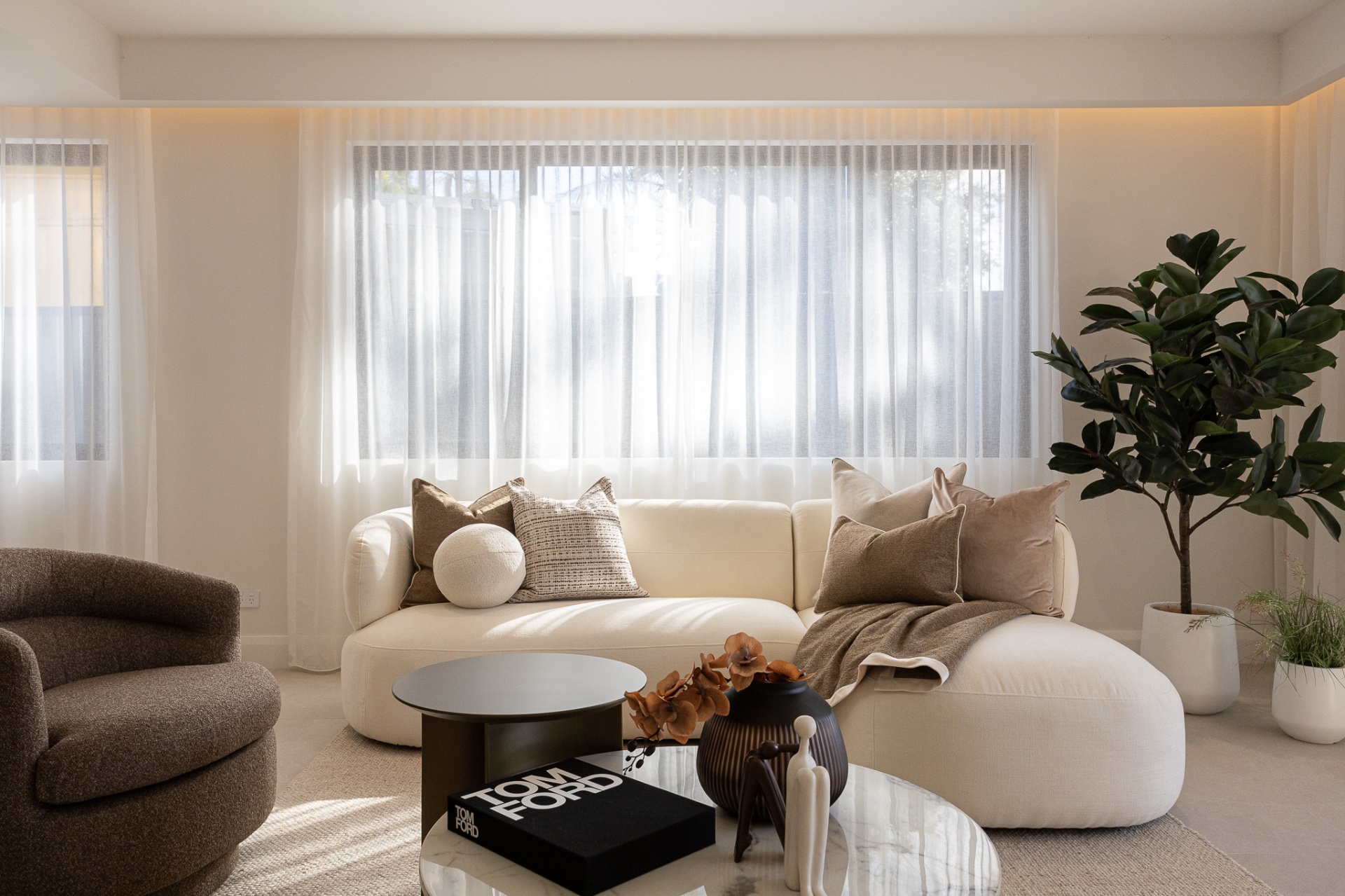 Formal lounge with sheer curtains